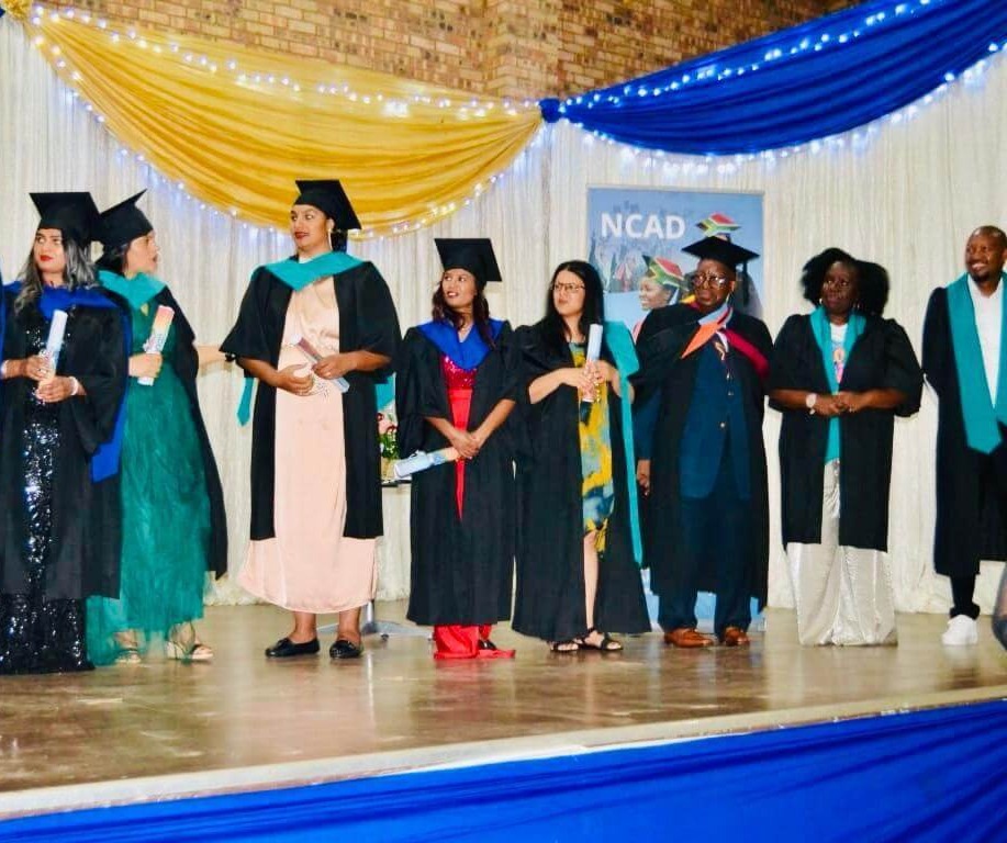 Mgwezane Training graduates celebrating on stage